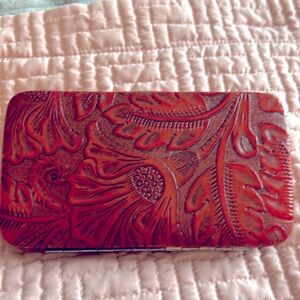 Vintage Lodis 100% red leather tooled clutch wallet; silvertoned metal frame.